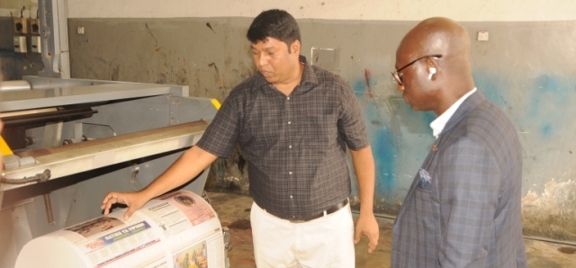 TGL printing manager Venkadachalam takes the UBA guest through the basics of newspaper printing.